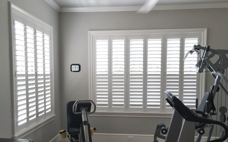 Orlando home gym with shuttered windows.